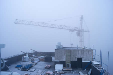 Construction site at the morning fogの写真素材