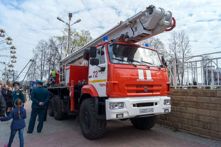 TVER, RUSSIA - APRILL, 30, 2016: Kamaz fire trucks with ladders at the bottom of a firefighter in...