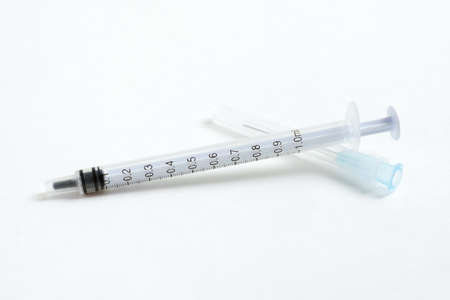 The component parts for assembly of a syringe lying on a white background.の写真素材