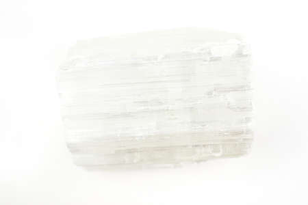 A piece of raw Selenite crystal on a white background.の写真素材