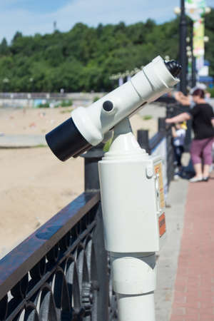 KHABAROVSK, RUSSIA - JULY, 22, 2017: Viewing binoculars on the embankment of the Amur river.