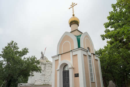 VOLOCHAEVKA-1, JEWISH AUTONOMOUS OBLAST, RUSSIA - JULY, 27, 2017: The chapel on the background of the monument Volochaevskaya battleのeditorial素材