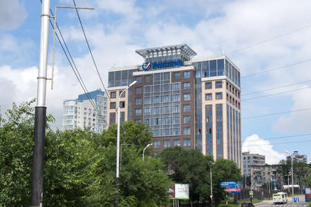KHABAROVSK, RUSSIA - JULY, 26, 2017: View multi-storey building in the summe, the inscription on the building - Transneft.のeditorial素材