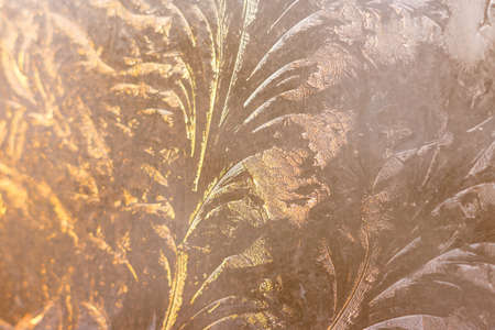 Ice patterns on the glass in winter.
