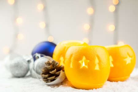 Christmas still life with orange candlesticks and ballsの写真素材