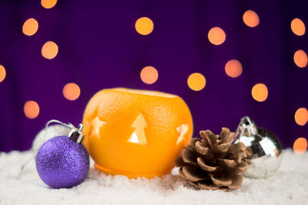 Christmas still life with orange candlesticks and ballsの写真素材