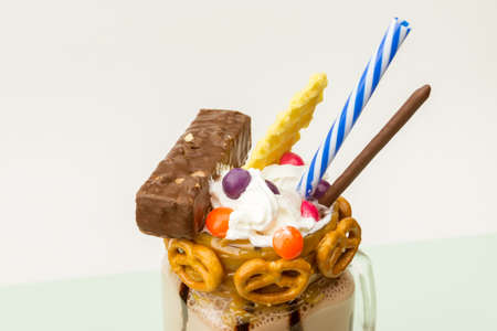 Chocolate freakshake with waffles, biscuits and sweets in a jarの写真素材