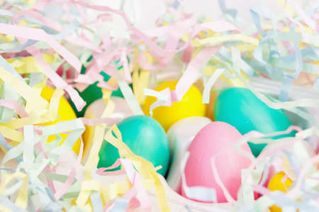 Colored multi-colored eggs and colored strips of paper, Easter decorの写真素材