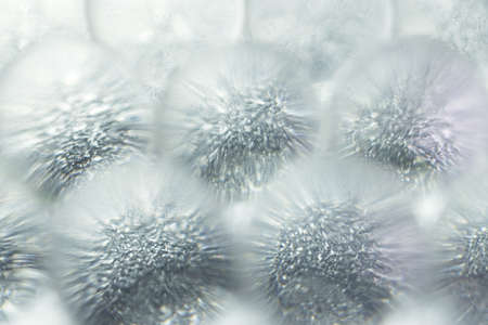 Abstract background of sparkles translucent through colorless hydrogel ballsの写真素材