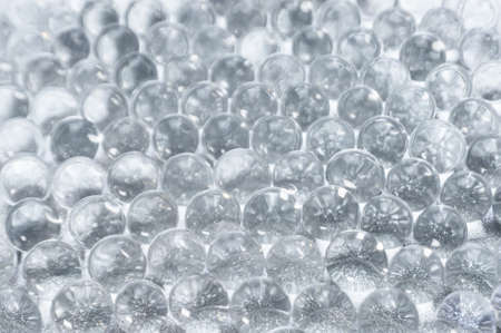Abstract background of sparkles translucent through colorless hydrogel ballsの写真素材