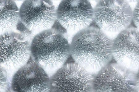 Abstract background of sparkles translucent through colorless hydrogel ballsの写真素材
