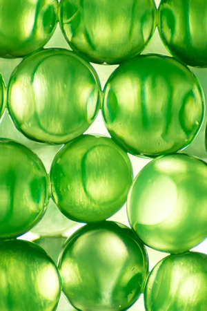 Abstract background of bright green balls and lightの写真素材