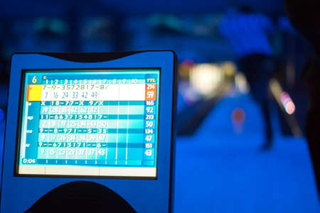 Bowling scoreboard in blue lightの写真素材