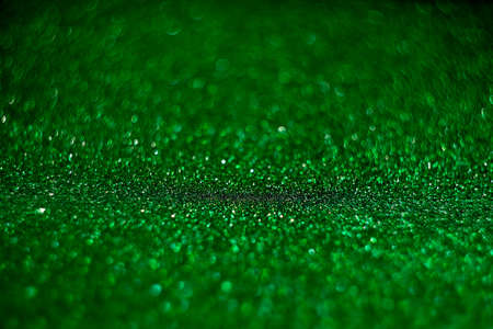 Abstract green background. Blur with the bokeh of shiny material. A fun celebration of St. Patricks Day party.の写真素材