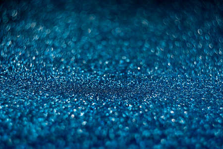 Abstract blue background. Blur with the bokeh of shiny material. Merry celebration, Christmas partyの写真素材