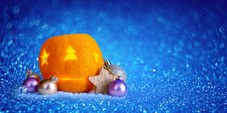 Beautiful Christmas background with orange peel candlesticks and balls. Celebrating New Year. Sparkle bokehの写真素材