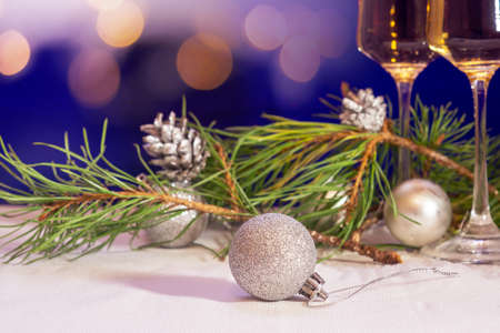 Christmas decorations and champagne glasses. New year backgroundの写真素材