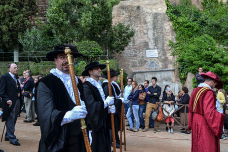 Puerta de la Justicia, Granada, Spain; April 19, 2014: priostes or Butler or older brothers of Santa...