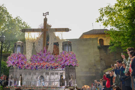 Granada, Spain; April 19, 2014: back of the image Santa MarÃ­a de la Alhambra surrounded by purple flowers witch publicのeditorial素材