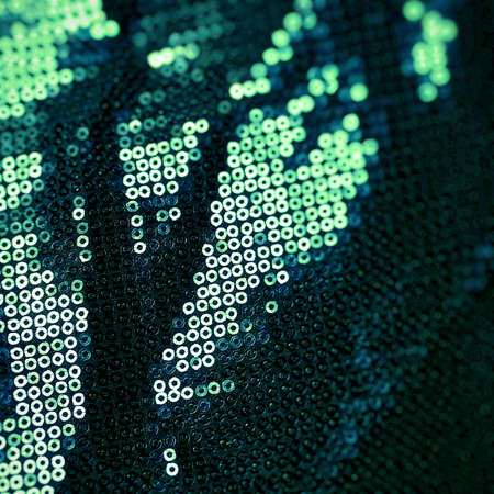 Green metallic sequin fabric texture bckground.の写真素材