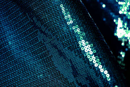 Green metallic sequin fabric texture bckground.の写真素材