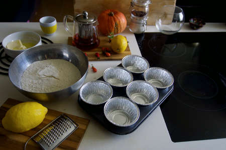The process of making lemon muffins in baking forms. Cooking process.の写真素材