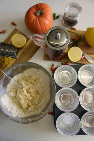 The process of making lemon muffins in baking forms. Cooking process.の写真素材