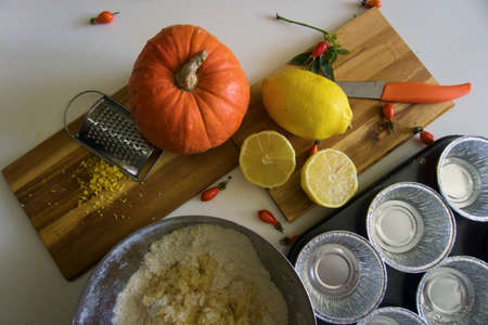 The process of making lemon muffins in baking forms. Cooking process.の写真素材