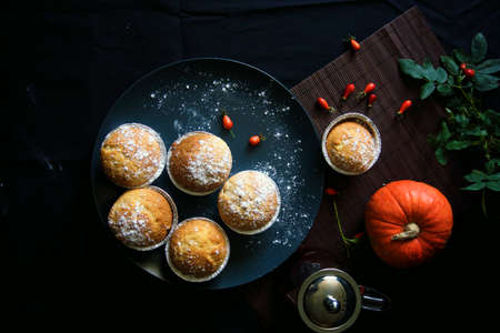 Homemade Lemon muffins in baking dish close up on black background.の写真素材