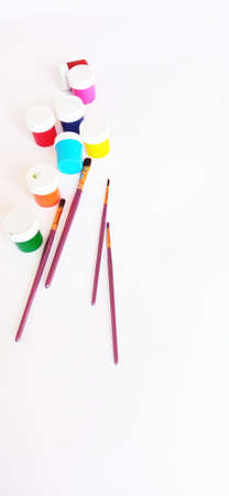 multicolored paints and brushes for painting with gouache acrylic oil watercolorの写真素材
