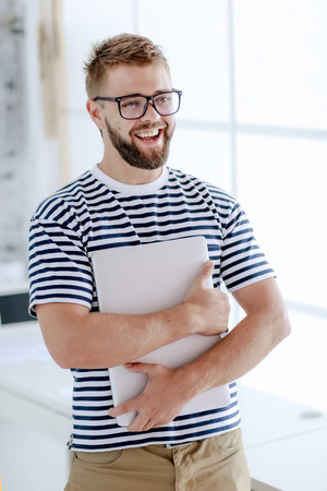 Happy man in officeの写真素材