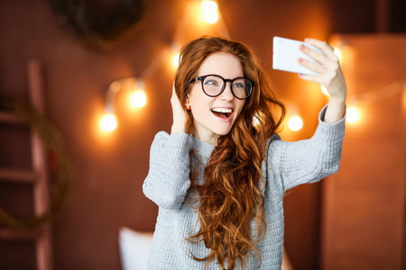 Lovely selphie red haired beautyの写真素材