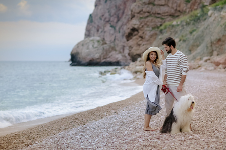Happy young couple having beach fun on vacation honeymoon travel holidays.の写真素材