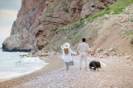 Happy young couple having beach fun on vacation honeymoon travel holidays.の写真素材