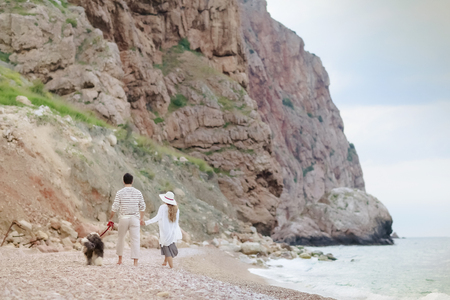 Happy young couple having beach fun on vacation honeymoon travel holidays.の写真素材
