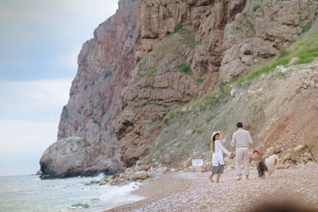 Happy young couple having beach fun on vacation honeymoon travel holidays.の写真素材