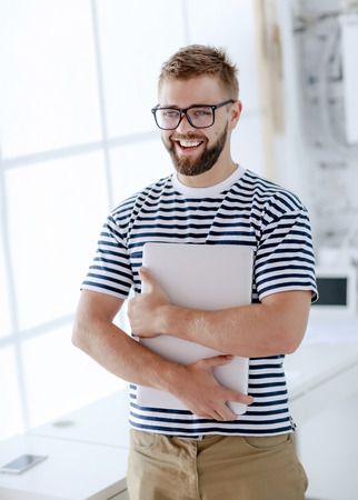 Caucasian man with beard relax on modern workspace. Office business comfortの写真素材