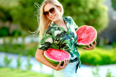 Beautiful happy girl with slice of ripe water-melon.の写真素材