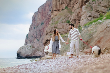 Happy young couple having beach fun on vacation honeymoon travel holidaysの写真素材