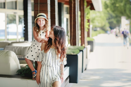 Mom brunette m summer Cafe little daughter.の写真素材