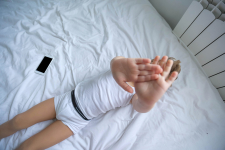 Five years old child sleeping with hat comfortably.の写真素材