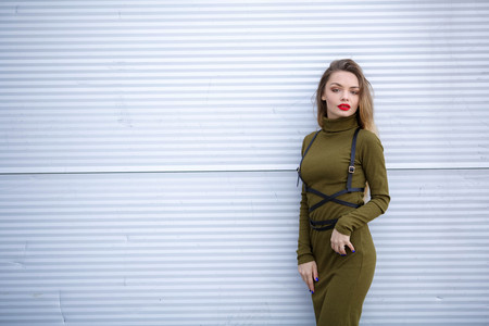 portrait of a young smiling woman outdoor. Happy face, closeup. Summer girl. Happy young adult woman smiling with teeth smile outdoors and walking on city street.の写真素材