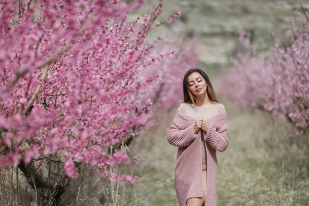 beautiful girl in a vintage style in a fabulous purple park.の写真素材