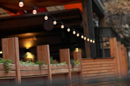 Close-up of a luminous street garland from a lamp of edison.の写真素材