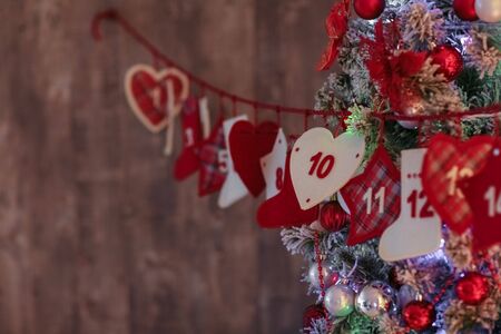 Christmas decorations in red and white. Hearts, boxes and garlands.の写真素材