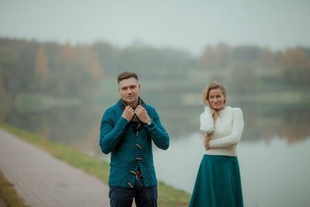 A couple of two a strong man and an elegant woman recently married on their honeymoon.