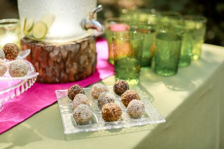 Festive wedding table, decorated with sweets and drinks.