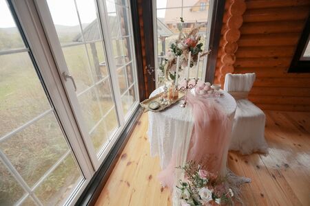 Table and chair for the bride in a wooden country house.の写真素材