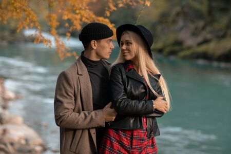 A pair of man and woman walk together and cuddle.の写真素材