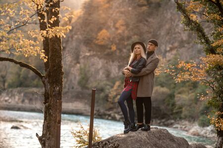 A pair of man and woman walk together and cuddle.の写真素材